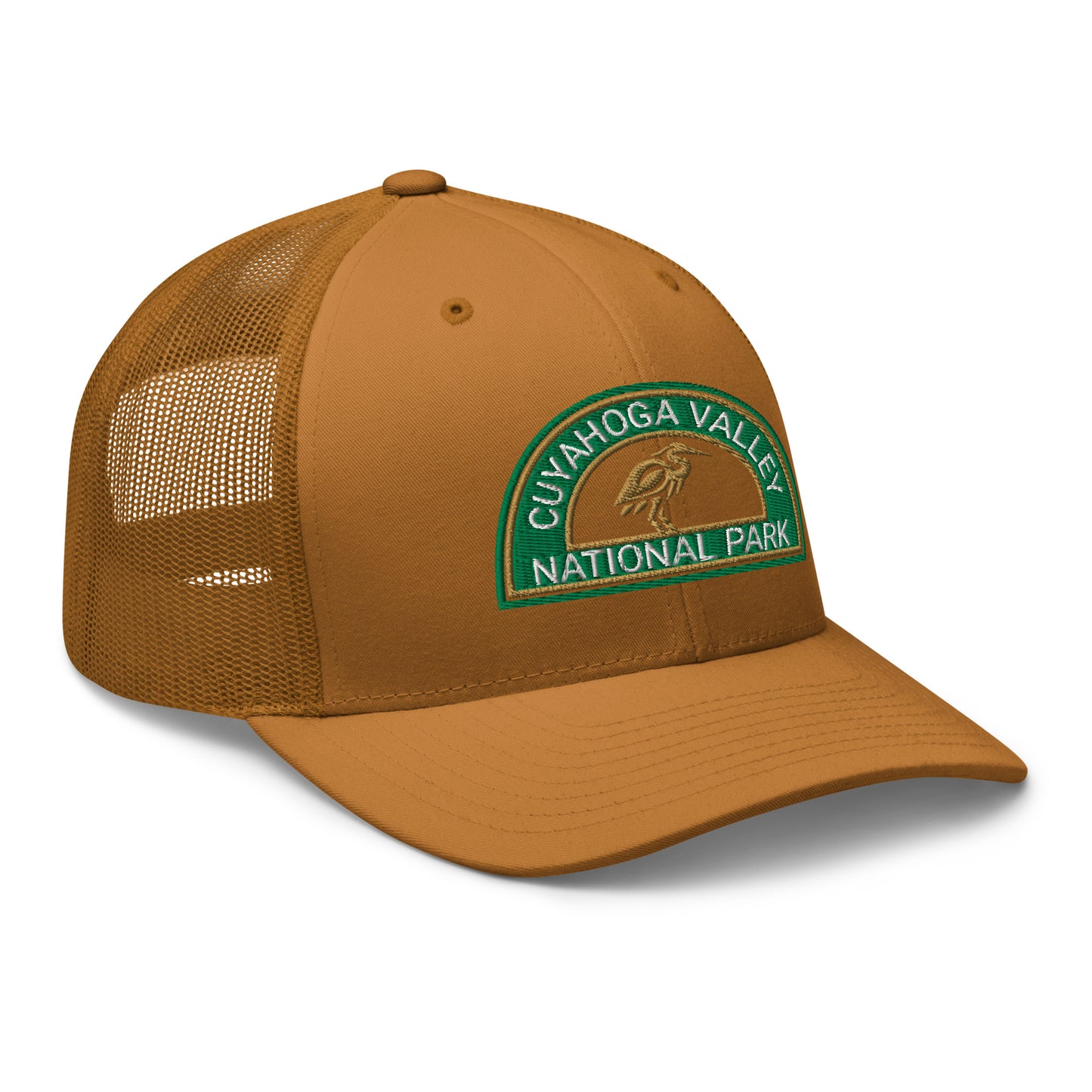 Cuyahoga Valley National Park Hat with a half moon embroiderd patch in Green and Sandstone featuring a Blue Heron on a Yupoong 6606 Caramel Hat - side view.