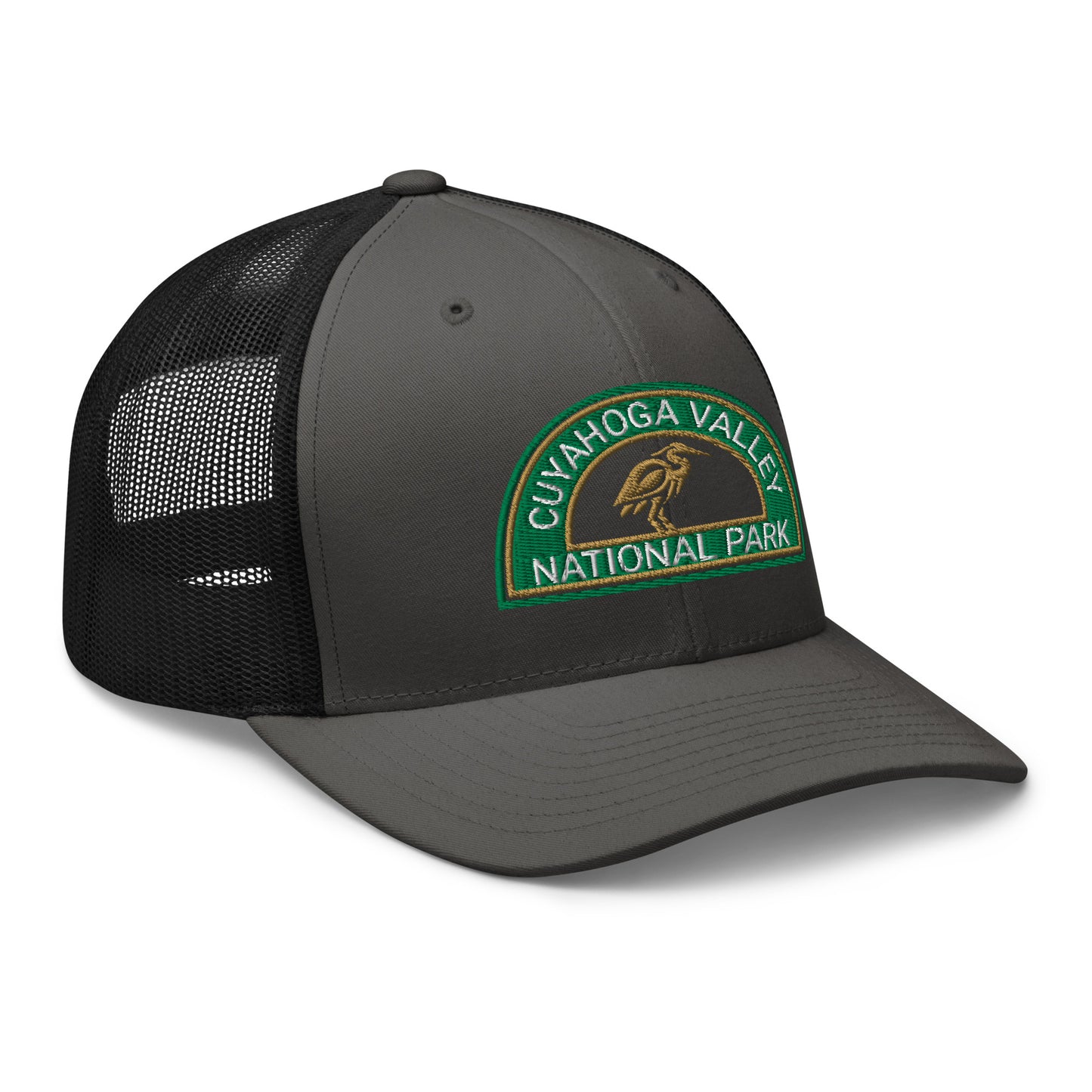 Cuyahoga Valley National Park Hat with a half moon embroiderd patch in Green and Sandstone featuring a Blue Heron on a Yupoong 6606 charcoal/black Hat - side view.