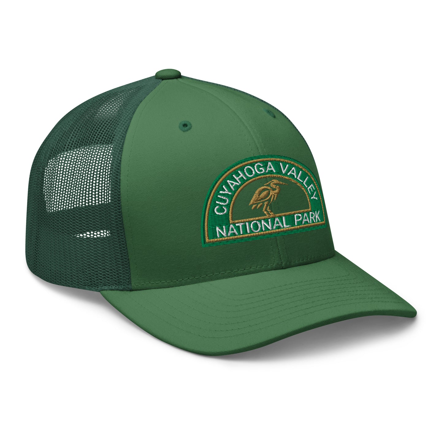 Cuyahoga Valley National Park Hat with a half moon embroiderd patch in Green and Sandstone featuring a Blue Heron on a Yupoong 6606 evergreen Hat - side view.