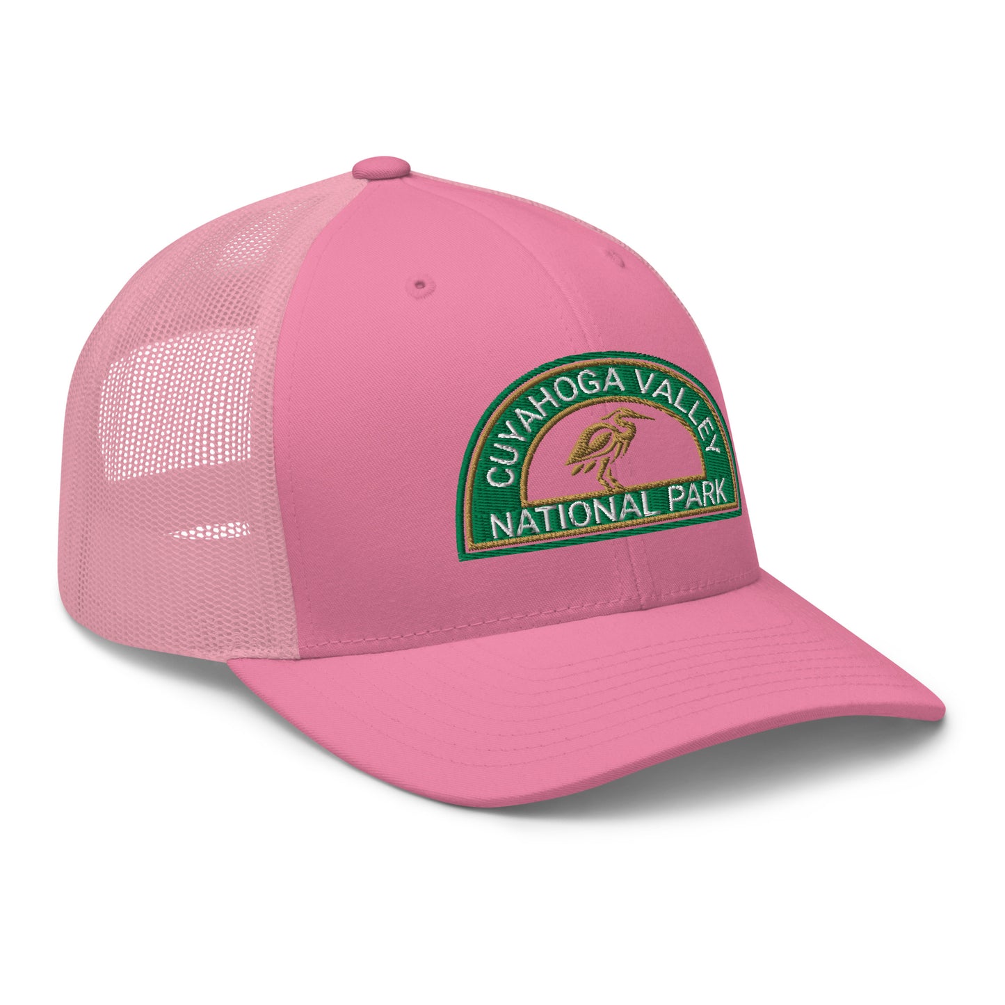 Cuyahoga Valley National Park Hat with a half moon embroiderd patch in Green and Sandstone featuring a Blue Heron on a Yupoong 6606 pink Hat - side view.