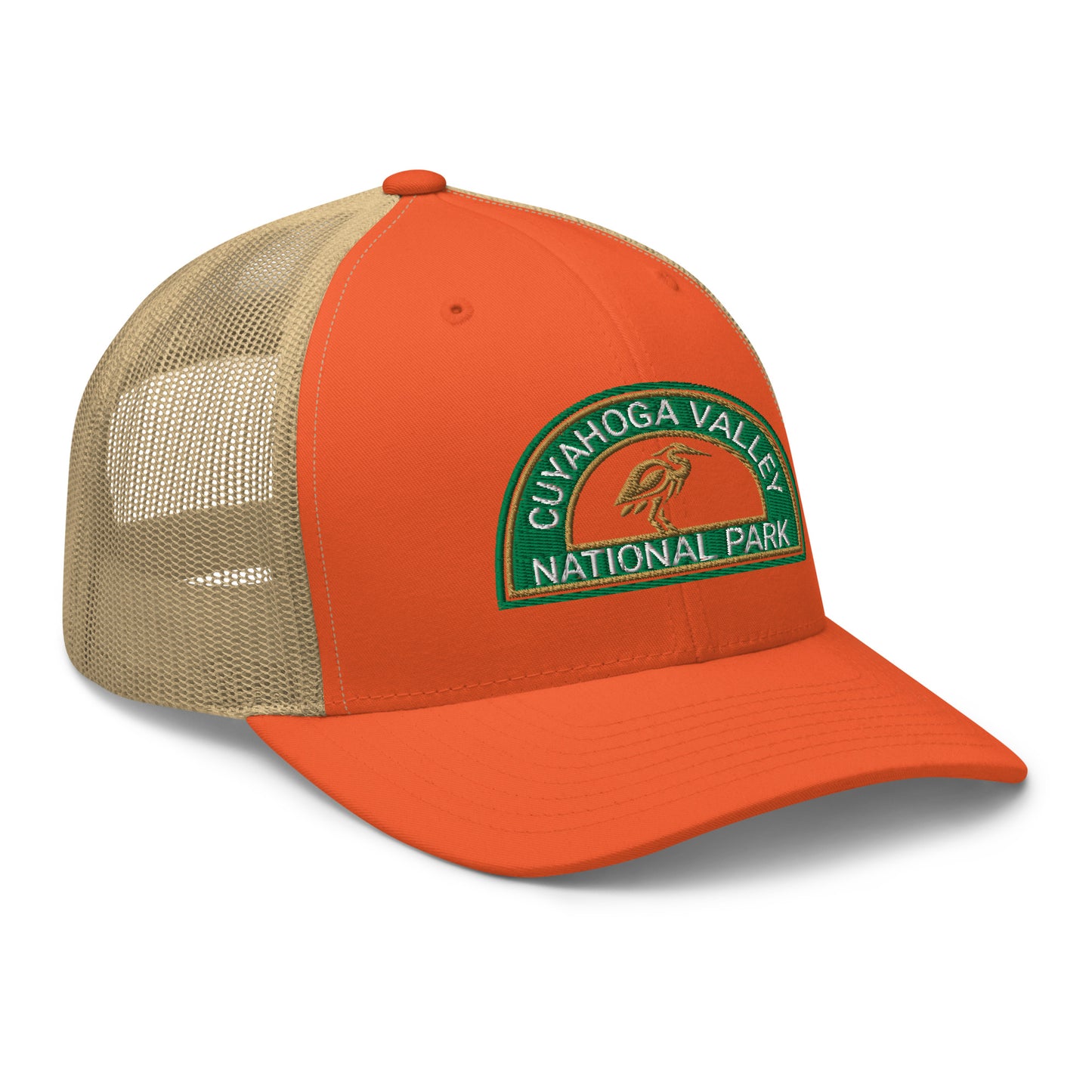 Cuyahoga Valley National Park Hat with a half moon embroiderd patch in Green and Sandstone featuring a Blue Heron on a Yupoong 6606 orange/khaki Hat - side view.
