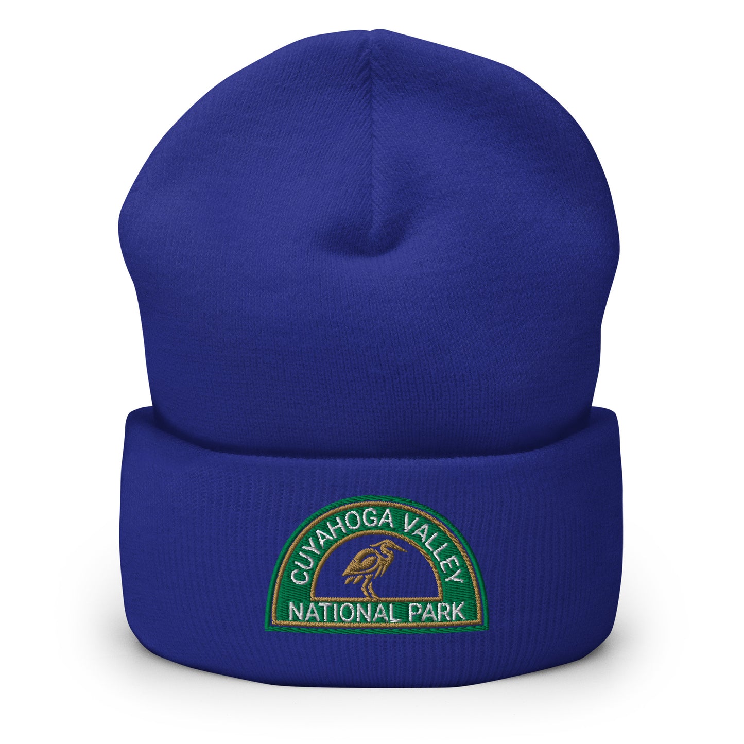 Cuyahoga National Park Beanie with a half moon embroidered patch with green and sandstone embroidery on a blue Yupoong 1501KC beanie.