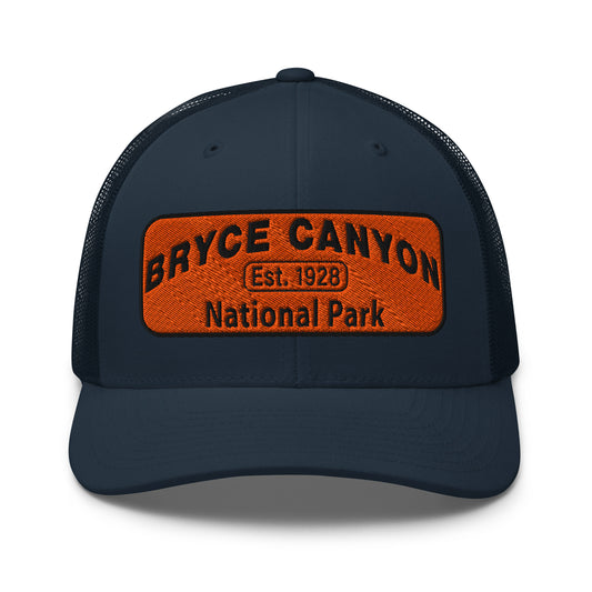 Bryce Canyon National Park Hat - Orange and Black Embroidered Patch - Yupoong 6606 Trucker Hat - Front View - Color: Navy