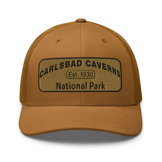 Carlsbad Caverns National Park Camo Hat - Gold and Black Embroidered Patch on Front of hat - Yupoong 6606 Trucker Hat - Front View - Color: Caramel