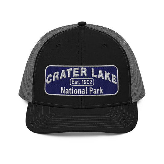 Crater Lake National Park Hat - Blue and White embroidered patch logo - Richardson 112 Trucker Hat - Front View - Color: Black/Charcoal