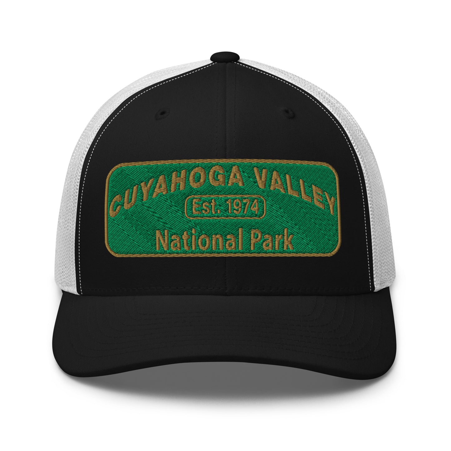 Cuyahoga National Park Hat with a green and gold embroidered national park styled patch on the front of a Yupoong 6606 black/white trucker hat - front view.