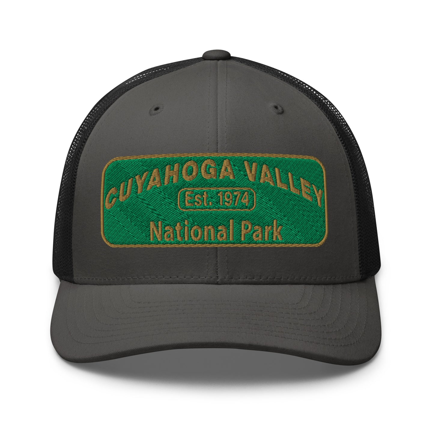 Cuyahoga National Park Hat with a green and gold embroidered national park styled patch on the front of a Yupoong 6606 charcoal/black trucker hat - front view.