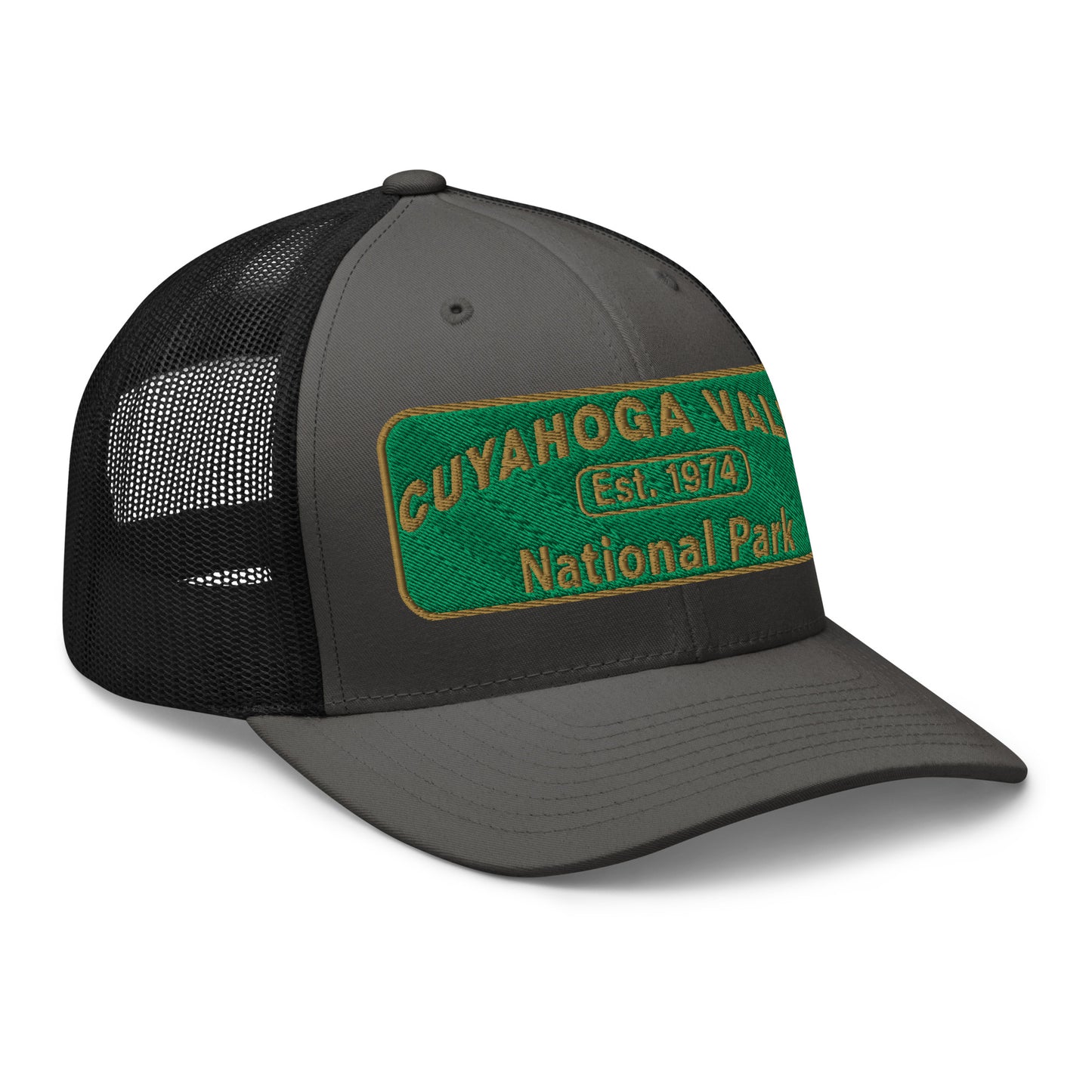 Cuyahoga National Park Hat with a green and gold embroidered national park styled patch on the front of a Yupoong 6606 charcoal/black trucker hat - side view.