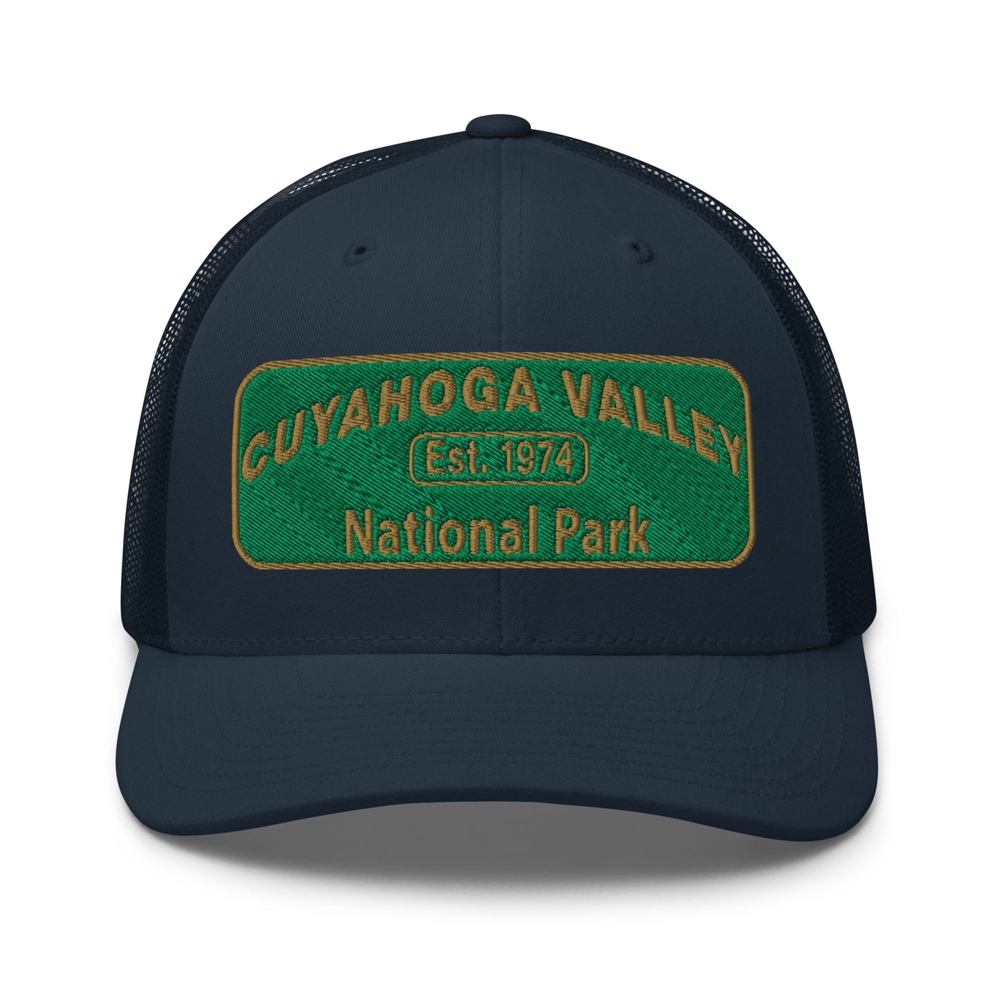 Cuyahoga National Park Hat with a green and gold embroidered national park styled patch on the front of a Yupoong 6606 navy trucker hat - front view.