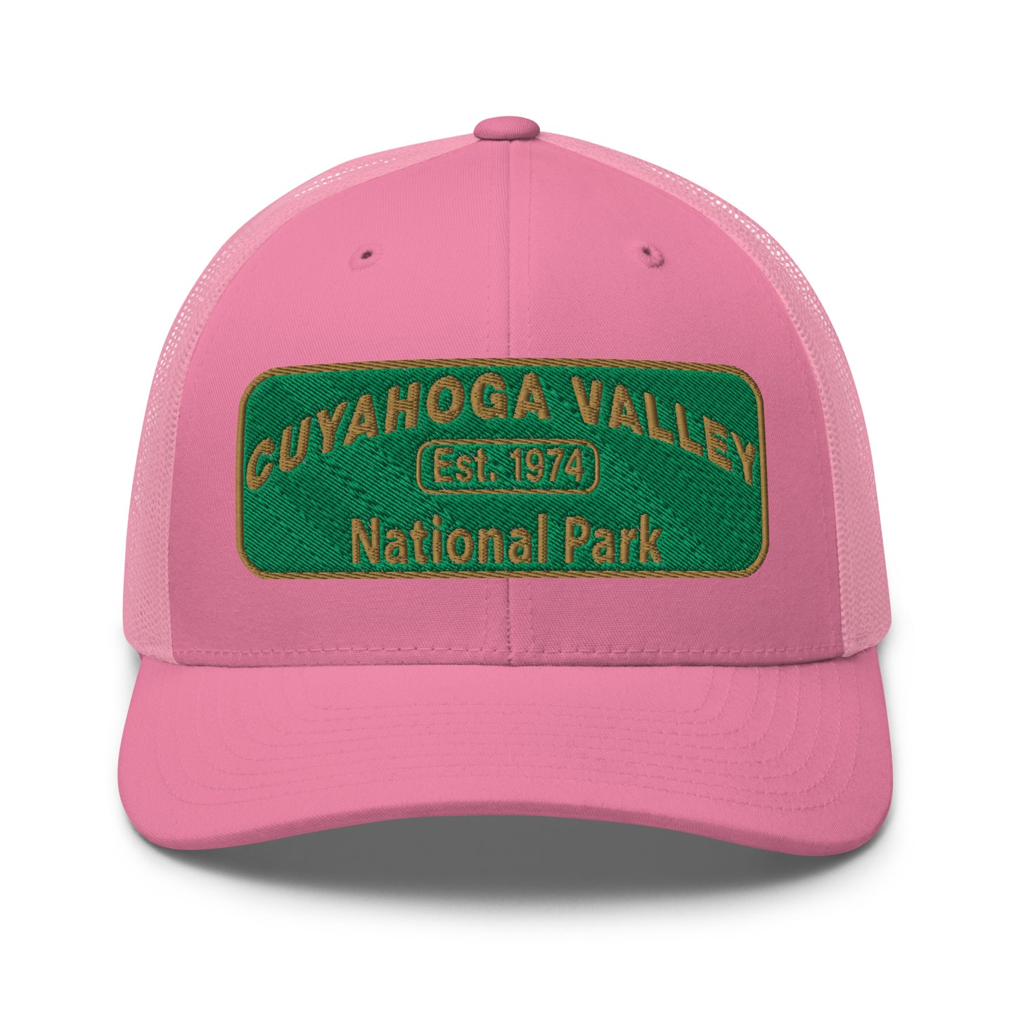 Cuyahoga National Park Hat with a green and gold embroidered national park styled patch on the front of a Yupoong 6606 pink trucker hat - front view.