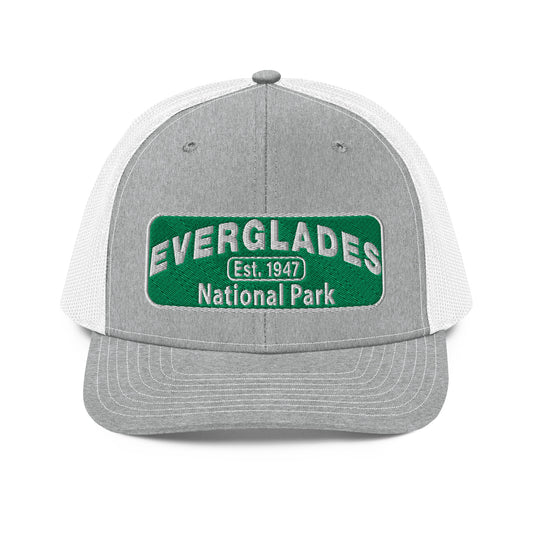 Everglades National Park Hat with a green and white embroidered park patch on a Heaher/White Richardson 112 trucker hat viewed from the front side.