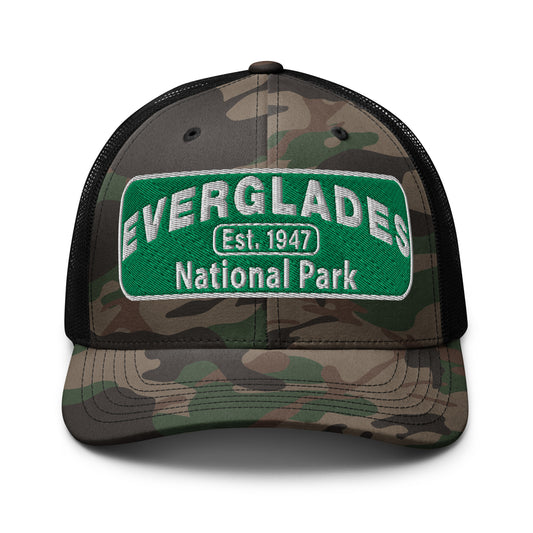 Everglades National Park Camo Hat with a green and white embroidered park patch on a camo/black Otto 105-1247 trucker hat viewed from the front side.