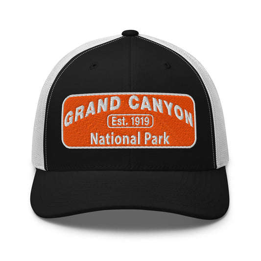 Black and white cap with Grand Canyon National Park logo on an orange background