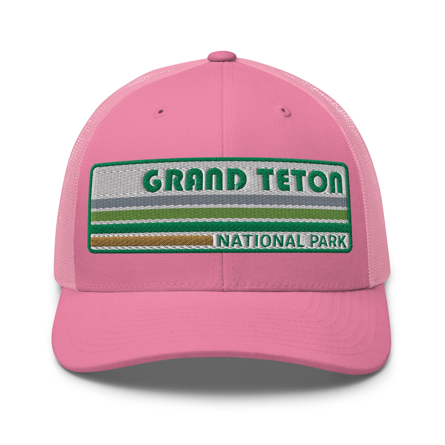 Grand Teton Hat with Retro 70's Style embroidered national park logo. Grand Teton National Park in Green on a pink Yupoong 6606 Trucker Hat front side view.