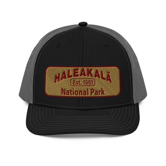 Haleakalā National Park Camo Hat - Gold and Red Embroidered Haleakalā National Park logo on front - Richardson 112 Trucker Hat - Front View  - Color:  Black/Charcoal
