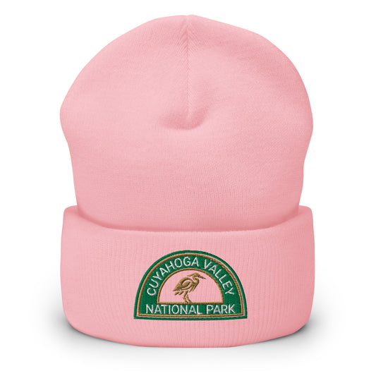 Cuyahoga National Park Beanie with a half moon embroidered patch with green and sandstone embroidery on a pink Yupoong 1501KC beanie.