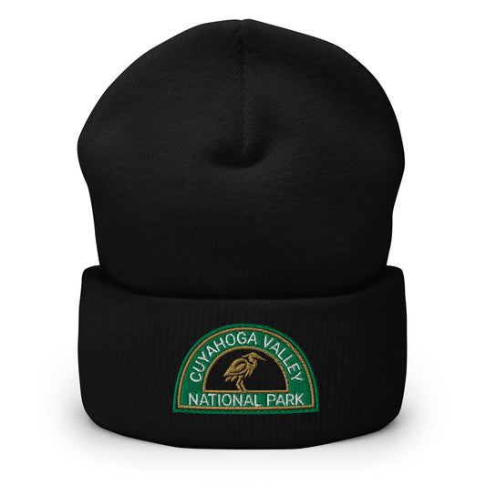 Cuyahoga National Park Beanie with a half moon embroidered patch with green and sandstone embroidery on a black Yupoong 1501KC beanie.