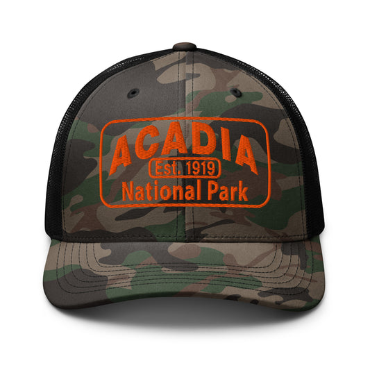 Acadia Hat with Camo Otto 105-1247 trucker hat with a camo front and black back and Acadia National Park Hat Logo embroidered in orange thread. Pictured from the front side.