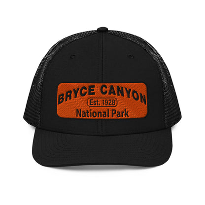 Bryce Canyon National Park Hat - Orange and Black Embroidered Patch - Richardson 112 Trucker Hat - Front View - Color:  Black