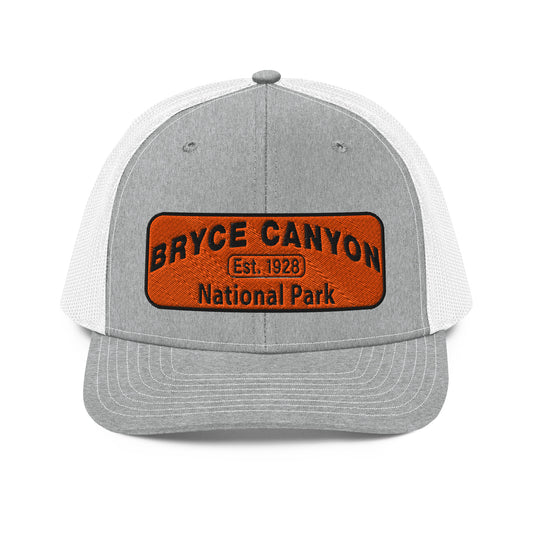 Bryce Canyon National Park Hat - Orange and Black Embroidered Patch - Richardson 112 Trucker Hat - Front View - Color:  Heather/White