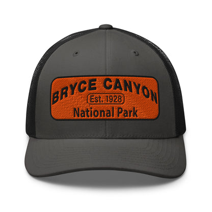 Bryce Canyon National Park Hat - Orange and Black Embroidered Patch - Yupoong 6606 Trucker Hat - Front View - Color: Charcoal/Black