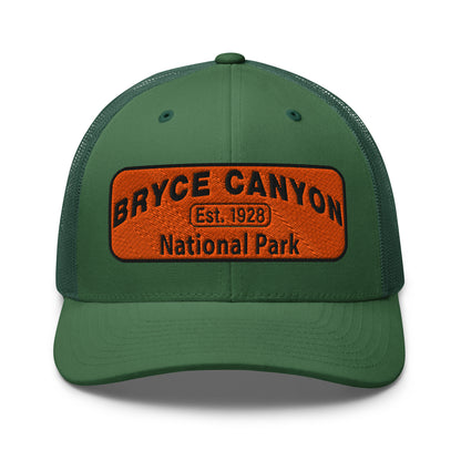 Bryce Canyon National Park Hat - Orange and Black Embroidered Patch - Yupoong 6606 Trucker Hat - Front View - Color: Evergreen