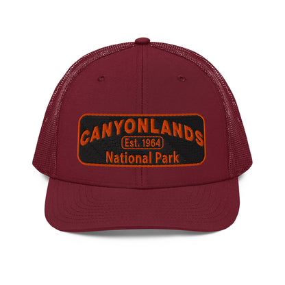 Canyonlands National Park Camo Hat - Black and orange embroidered patch logo - Richardson 112 Trucker Hat - Front View - Color: Cardinal