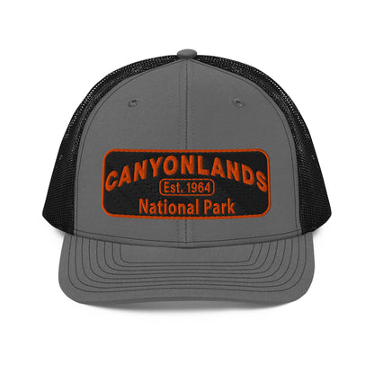 Canyonlands National Park Camo Hat - Black and orange embroidered patch logo - Richardson 112 Trucker Hat - Front View - Color: Charcoal/Black
