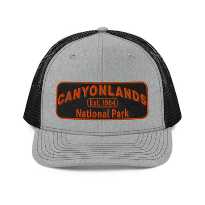 Canyonlands National Park Camo Hat - Black and orange embroidered patch logo - Richardson 112 Trucker Hat - Front View - Color: Heather/Black