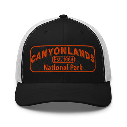 Canyonlands National Park Camo Hat - Black and orange embroidered patch logo - Yupoong 6606 Trucker Hat - Front View - Color: Black/White