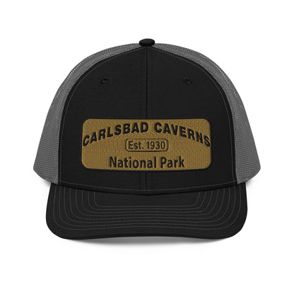 Carlsbad Caverns National Park Camo Hat - Gold and Black Embroidered Patch on Front of hat - Richardson 112 Trucker Hat - Front View - Color: Black/Charcoal