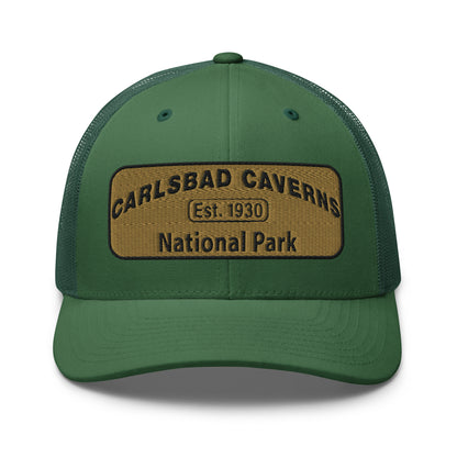 Carlsbad Caverns National Park Camo Hat - Gold and Black Embroidered Patch on Front of hat - Yupoong 6606 Trucker Hat - Front View - Color: Evergreen