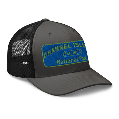 Channel Islands National Park Hat - Blue and Green Embroidered Patch on Front of hat - Yupoong 6606 Trucker Hat - Side View - Color: Charcoal/Black