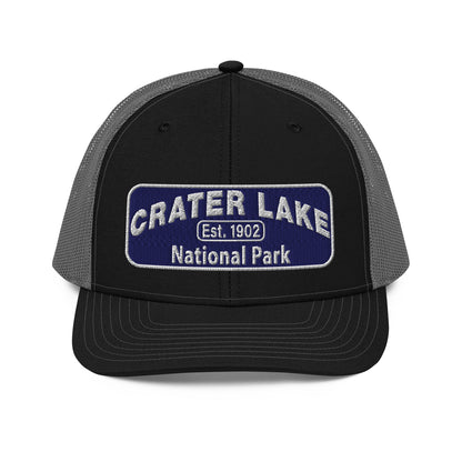 Crater Lake National Park Hat - Blue and White embroidered patch logo - Richardson 112 Trucker Hat - Front View - Color: Black/Charcoal