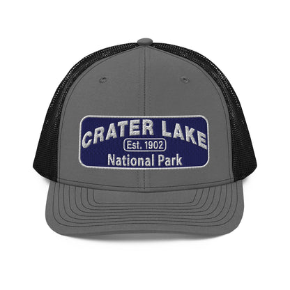 Crater Lake National Park Hat - Blue and White embroidered patch logo - Richardson 112 Trucker Hat - Front View - Color: Charcoal/Black