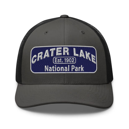 Crater Lake National Park Hat - Blue and White embroidered patch logo - Yupoong 6606 Trucker Hat - Front View - Color: Charcoal/Black