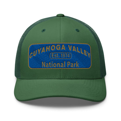 Cuyahoga Valley National Park Hat with a blue and gold embroidered park patch on the front on a Yupoong 6606 evergreen trucker hat - front view.
