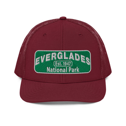 Everglades National Park Hat with a green and white embroidered park patch on a Cardinal Richardson 112 trucker hat viewed from the front side.