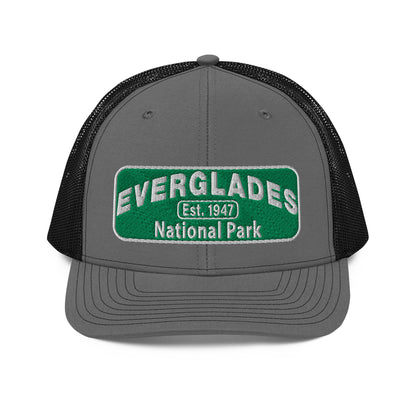Everglades National Park Hat with a green and white embroidered park patch on a Charcoal/Black Richardson 112 trucker hat viewed from the front side.