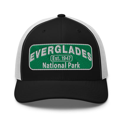Everglades National Park Hat with a green and white embroidered national park patch on a black/white Yupoong 6606 Trucker hat viewed from the front.