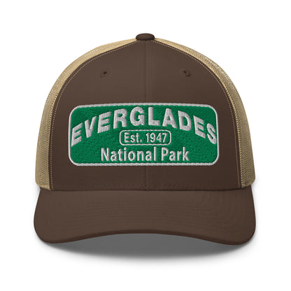Everglades National Park Hat with a green and white embroidered national park patch on a brown/khaki Yupoong 6606 Trucker hat viewed from the front.