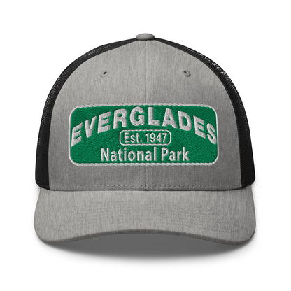 Everglades National Park Hat with a green and white embroidered national park patch on a heather/black Yupoong 6606 Trucker hat viewed from the front.